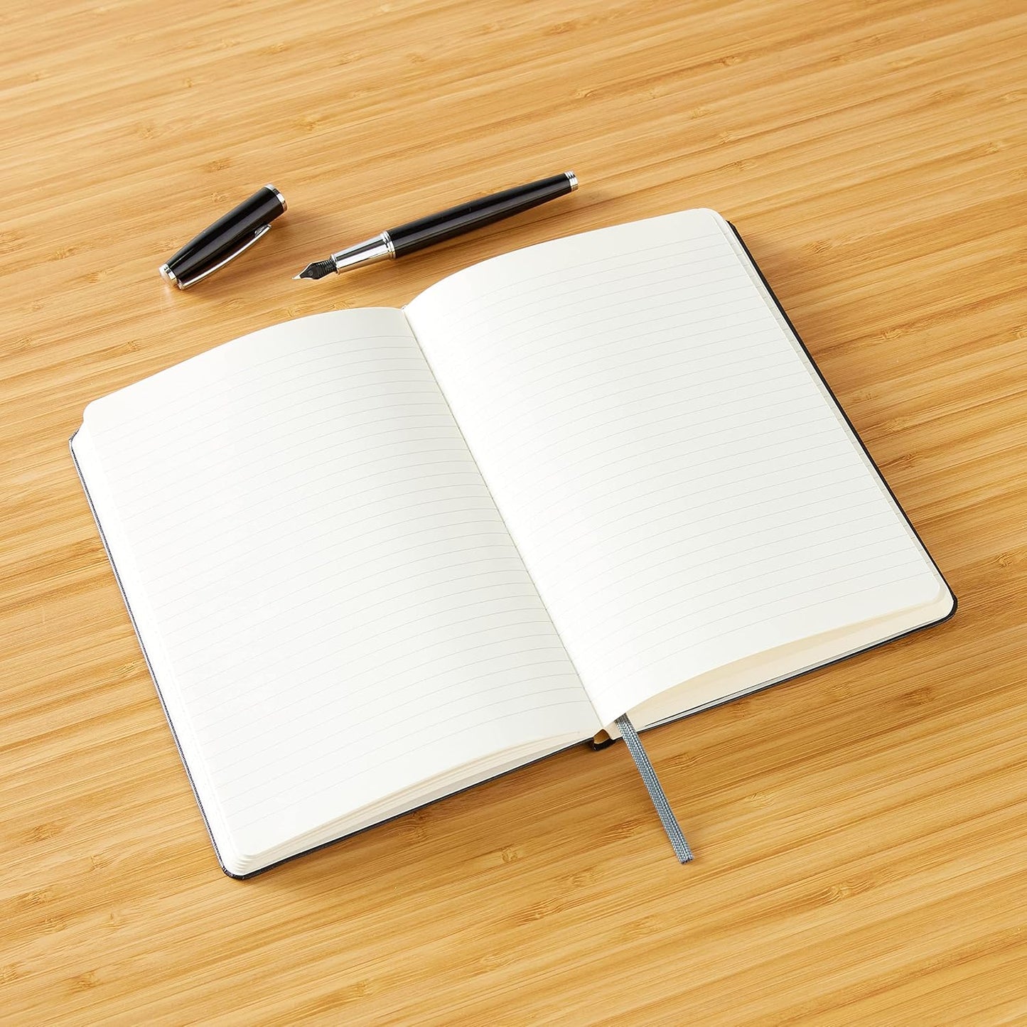 Amazon Basics Classic Lined Writing Notebook for Note Taking and Journaling, Hardcover with Elastic Closure, 240 Pages, 5" x 8.25", Black